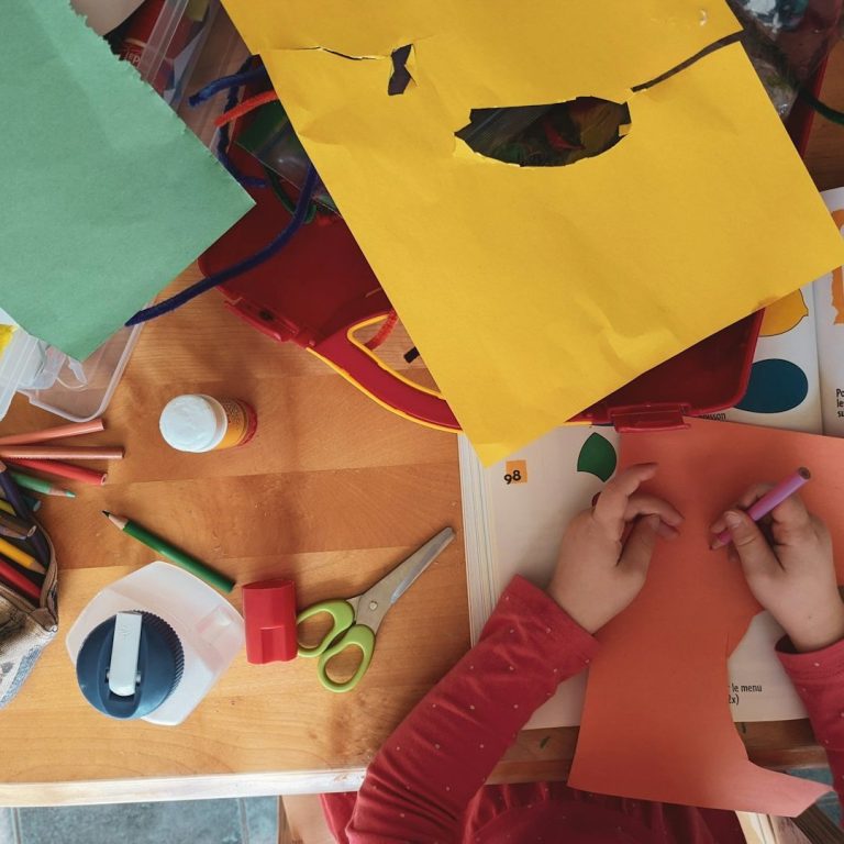 Children being creative with colourful arts and crafts.