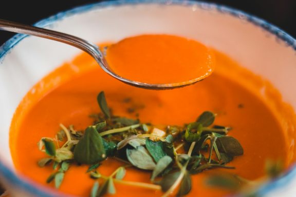 Tomato soup & spoon.