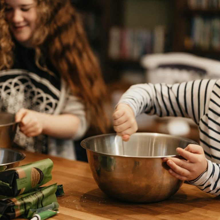 Children mixing ingredients in the kitchen.